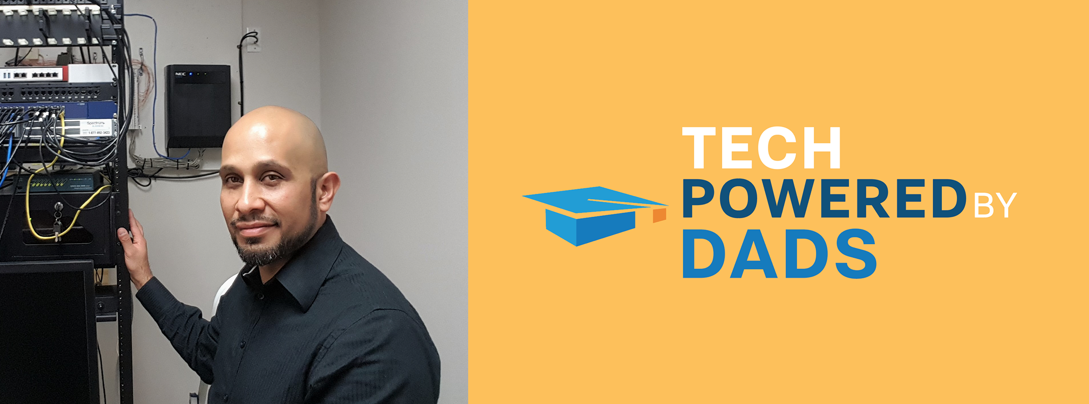 Man standing in a server room smiling, next to the "Tech Powered By Dads" logo on a yellow banner.