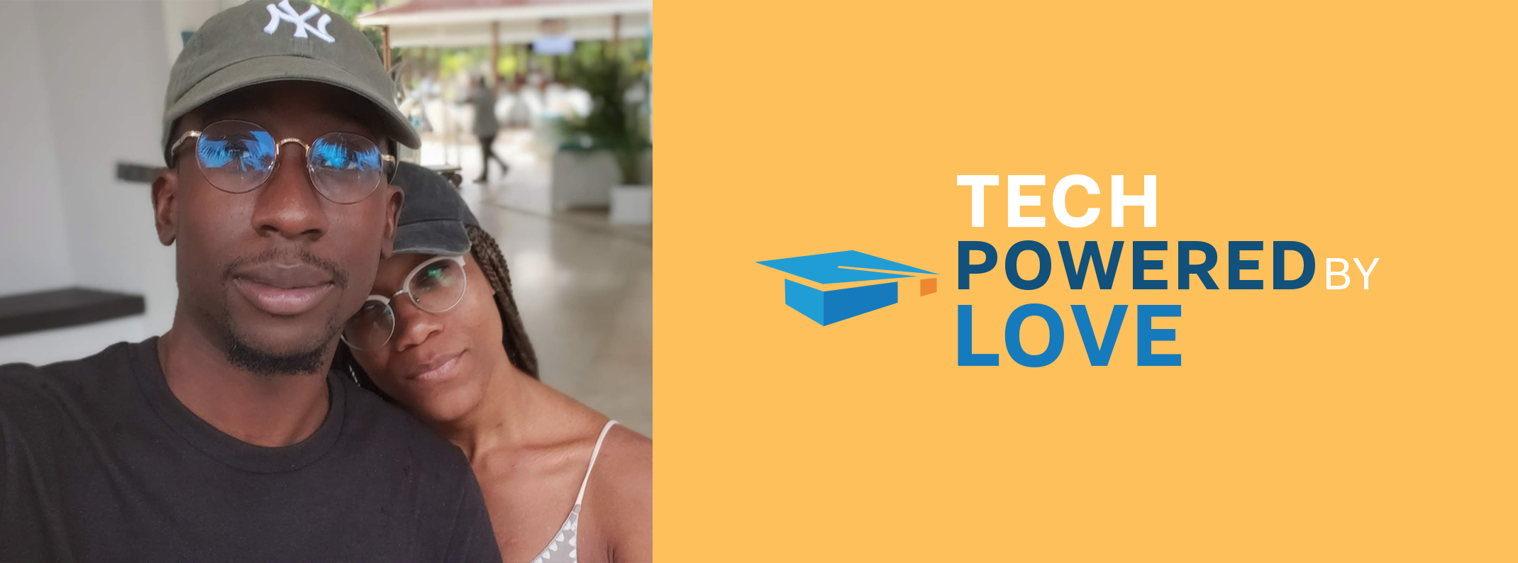 Two people posing closely, next to the "Tech Powered By Love" logo on a yellow banner.