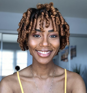 headshot of Per Scholas graduate after receiving cost-free tech training