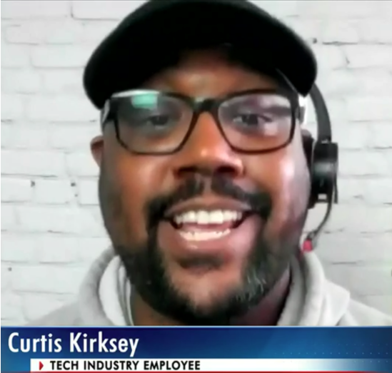 Curtis Kirksey, tech industry employee, smiling and speaking on a video call with a headset.