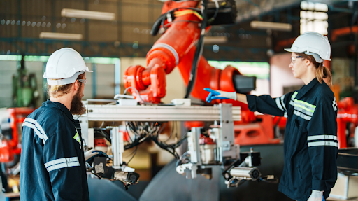 Technician working working with a robot
