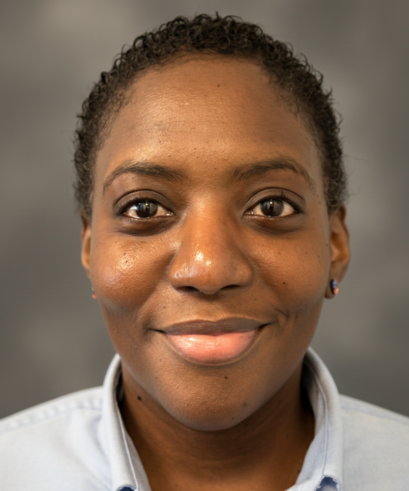 Headshot of LaQuana Hill smiling in front of a neutral background.