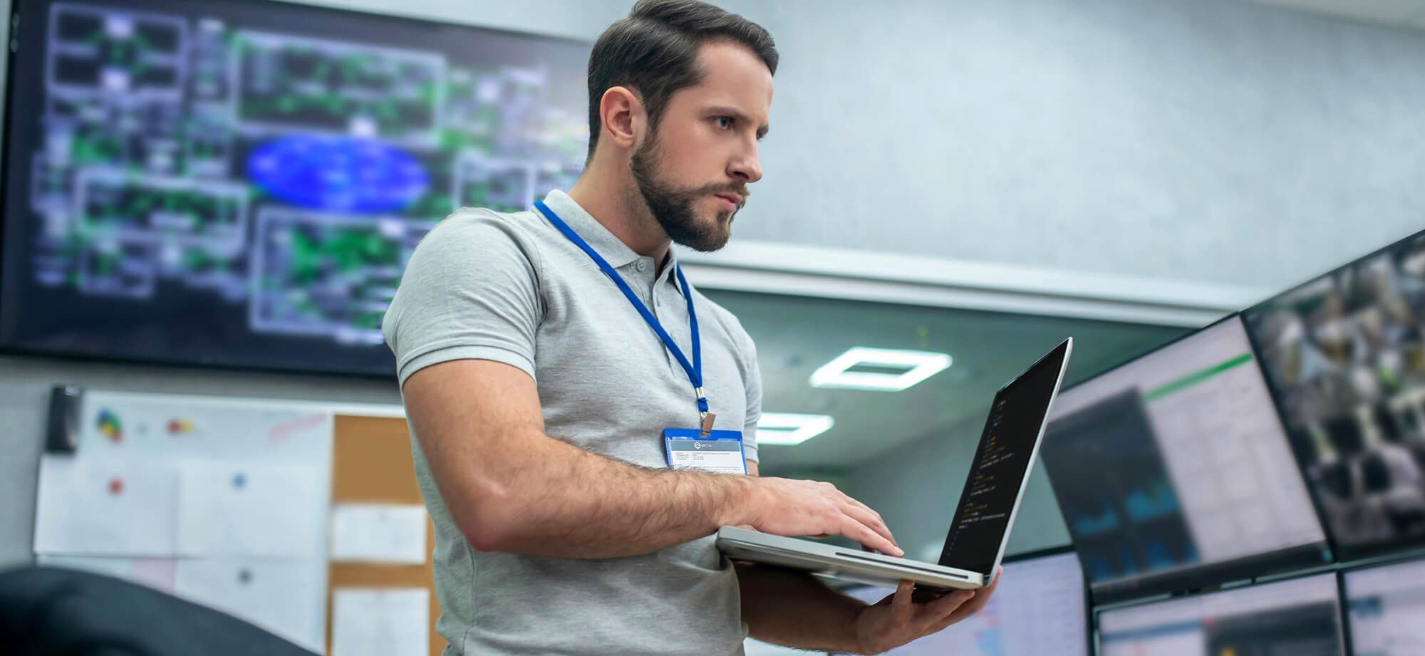 Tech worker reviewing in workspace