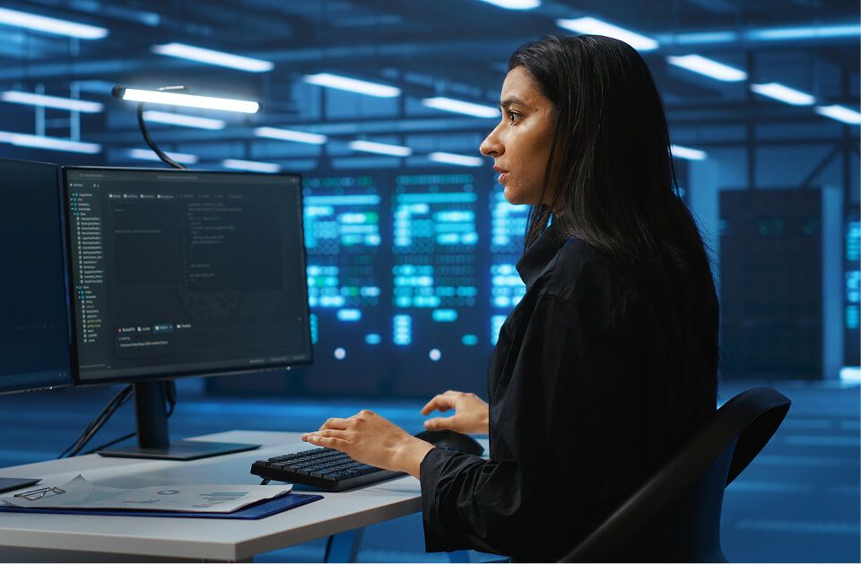 Technician working in high tech server room