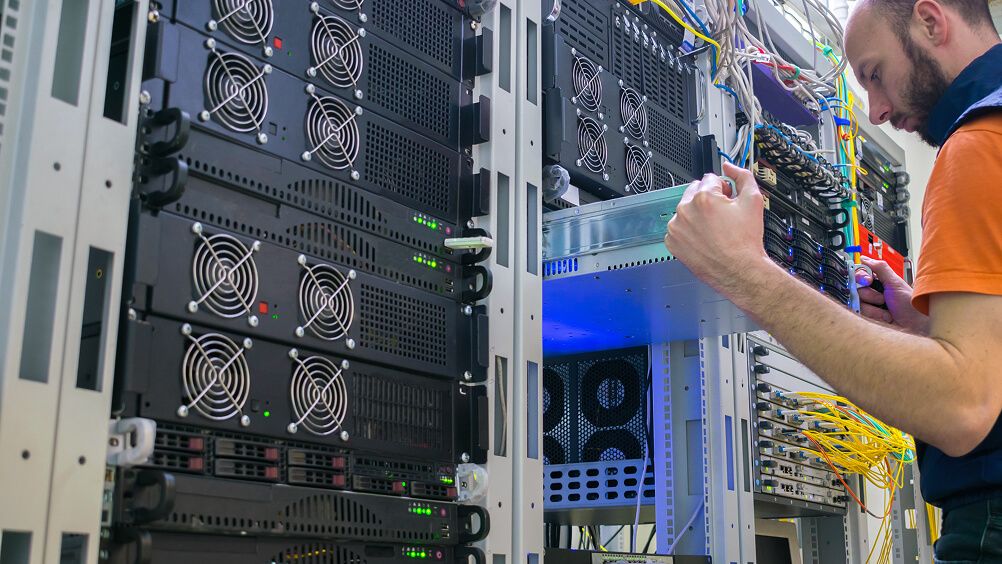 Data worker technician working in server room
