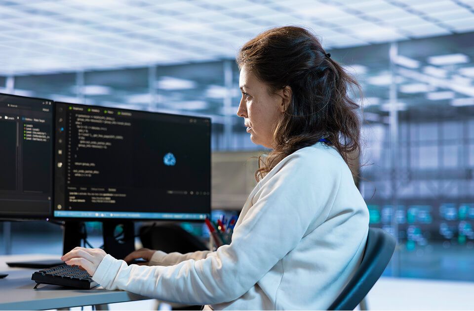 Woman in office tasked with monitoring data center supercomputers