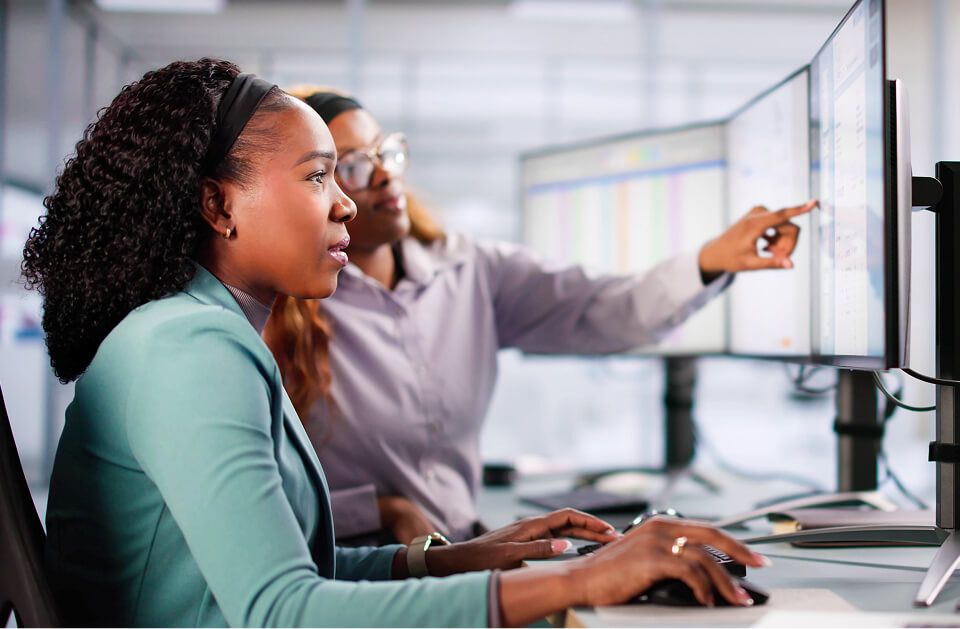 Group of office workers training on computer