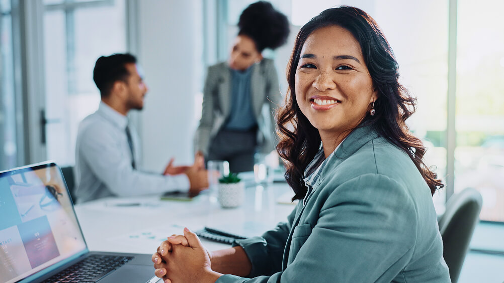 Portrait of employee in office workspace