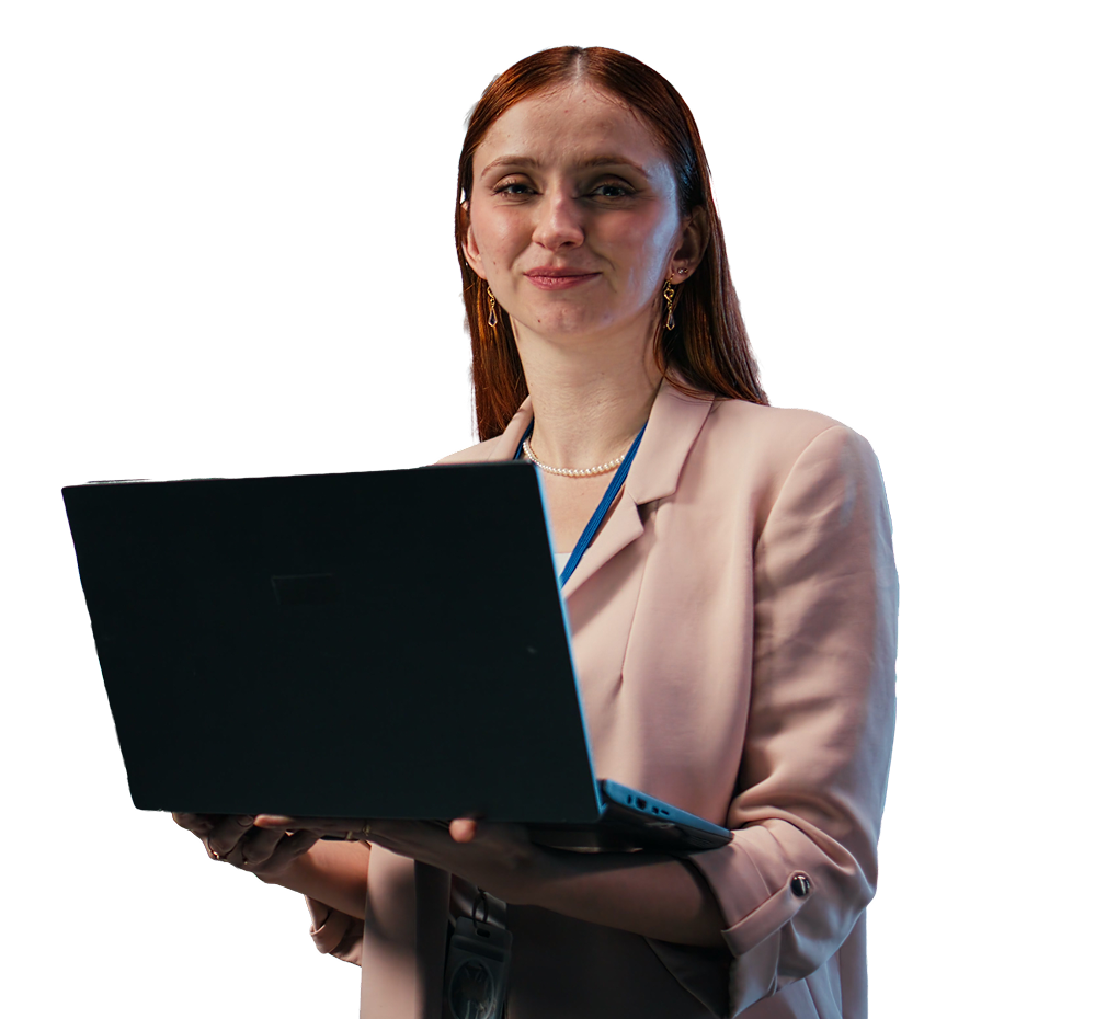 Data center female technician overseeing large scale IT infrastructure supercomputers with laptop.