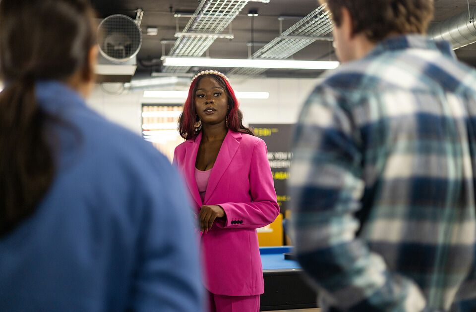 Female professional leading a meeting.