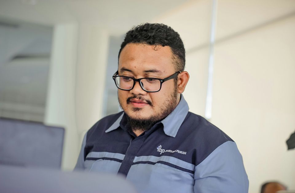 Young professional male with glasses.