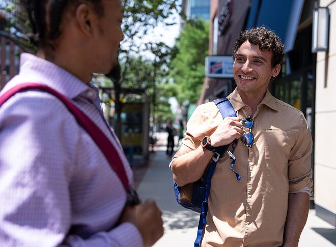 students talking outside of campus