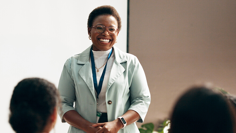 Woman leading a workshop to a group of employees